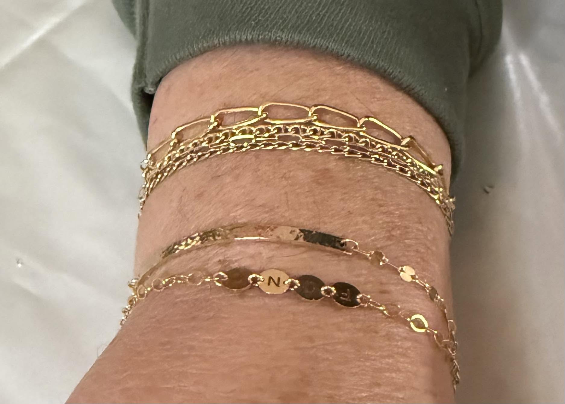 Stacked gold permanent bracelets